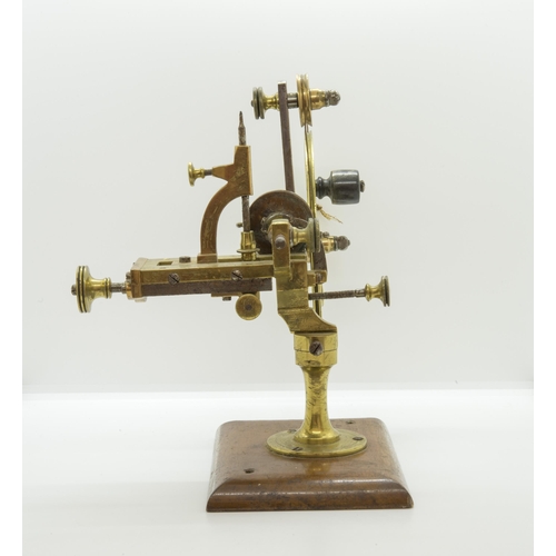 1504 - AN ANTIQUE WATCHMAKERS LATHE,19th century, in brass and steel on a mahogany base.16 x 28 cms... 