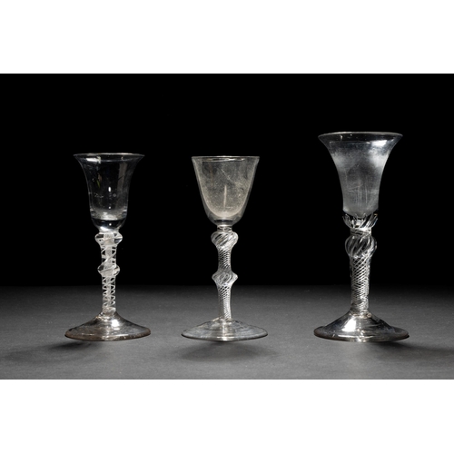 1285 - A GEORGIAN OPAQUE TWIST CORDIAL GLASS with bell shaped bowl and knopped stem, an air twist example (... 