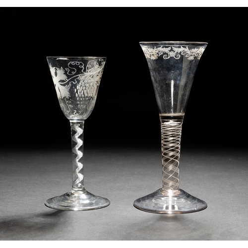 1287 - A GEORGIAN FINE OPAQUE TWIST WINE GLASS the trumpet shaped bowl with engraved border and an airtwist... 