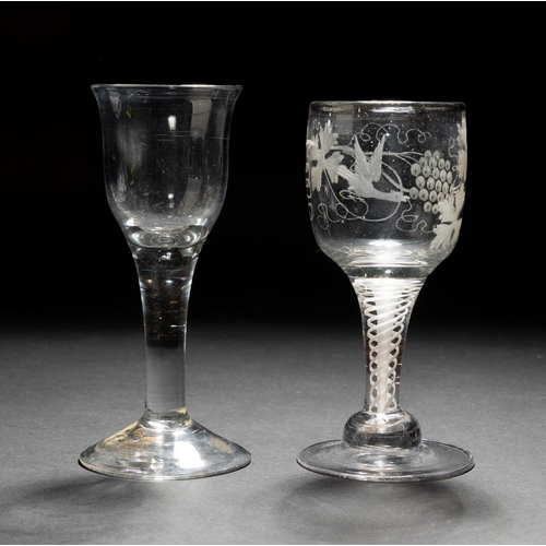 1288 - A GEORGIAN OPAQUE TWIST WINE GLASS the bowl engraved with vines and a bird upon a domed foot, togeth... 