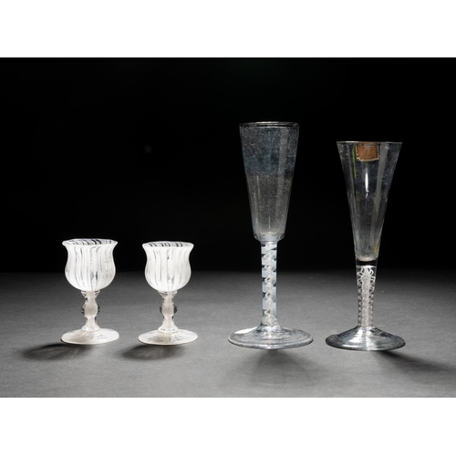 1291 - A TALL GEORGIAN OPAQUE TWIST FLUTE, another opaque twist flute with ribbed bowl and a pair of small ... 