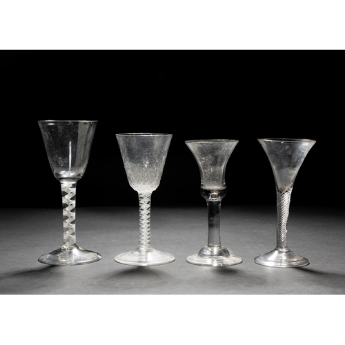 1294 - A GEORGIAN OPAQUE TWIST WINE GLASS, another, an air twist glass and a bell         shaped wine glass... 