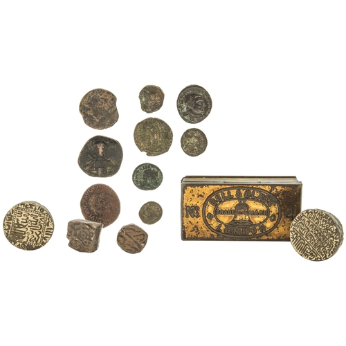 285 - AN INDO-PERSIAN DIE OR SEAL, ANOTHER, TWO INDIAN BRONZE COINS and assorted Roman Bronze coins.