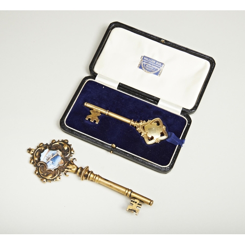 789 - A SILVER GILT AND ENAMEL PRESENTATION KEY TO ** WILSON BY THE ARCHITECTS ON THE OPENING OF VICTORIA ... 