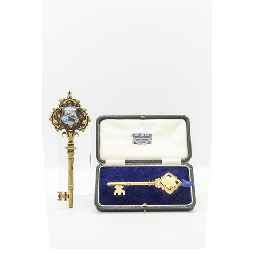 789 - A SILVER GILT AND ENAMEL PRESENTATION KEY TO ** WILSON BY THE ARCHITECTS ON THE OPENING OF VICTORIA ... 