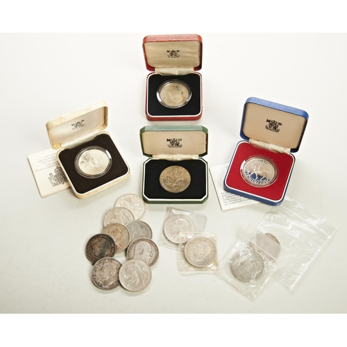 322 - A 1977 PROOF SILVER JUBILEE CROWN, A QUEEN MOTHER 80TH BIRTHDAY PROOF CROWN, a Buthan proof coin, a ... 