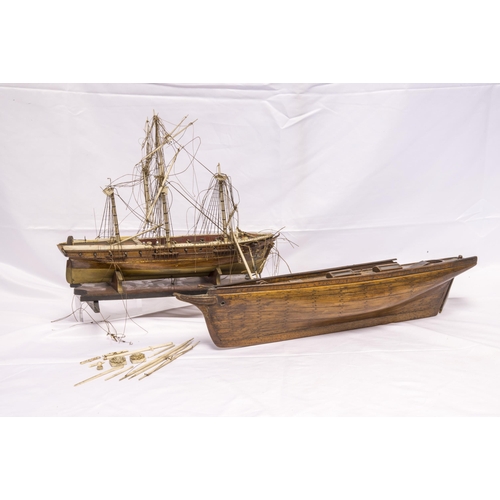 1424 - A 19TH CENTURY BOAT HULL MODEL, plank built with deck details including         two glazed deck ligh... 