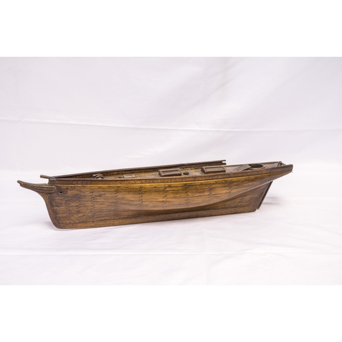 1424 - A 19TH CENTURY BOAT HULL MODEL, plank built with deck details including         two glazed deck ligh... 