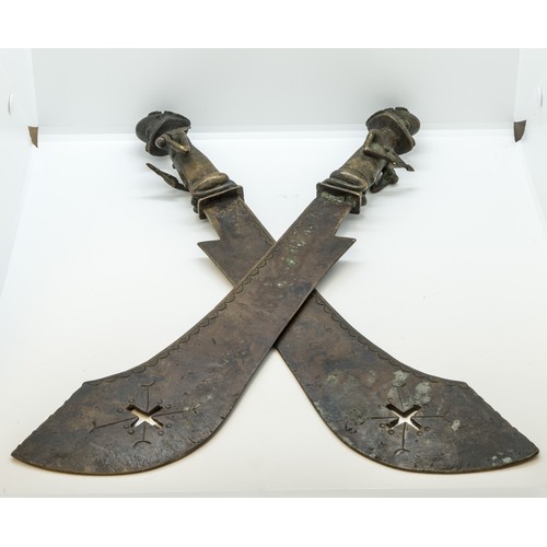 1335 - A PAIR OF YORUBA COPPER ALLOY SWORDS WITH FIGURAL HILTS, a ceremonial copper alloy And iron Tiv axe ... 