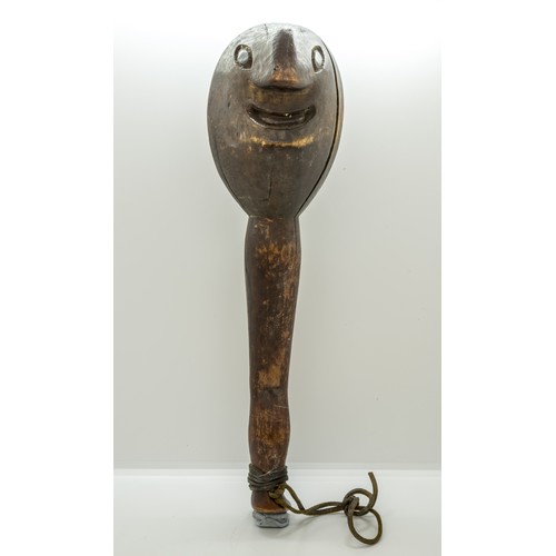 1336 - A 'FOLK ART' CLUB OR SHILLELAGH, carved with a Janus head top, the handle as a leg and foot.37 cms l... 