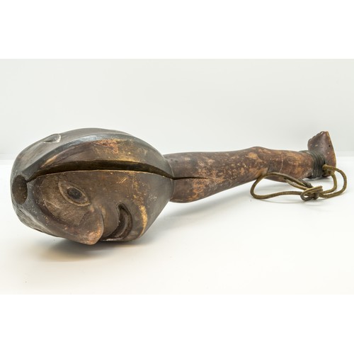 1336 - A 'FOLK ART' CLUB OR SHILLELAGH, carved with a Janus head top, the handle as a leg and foot.37 cms l... 