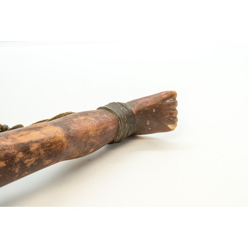 1336 - A 'FOLK ART' CLUB OR SHILLELAGH, carved with a Janus head top, the handle as a leg and foot.37 cms l... 