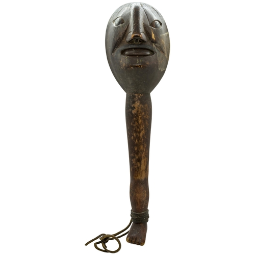 1336 - A 'FOLK ART' CLUB OR SHILLELAGH, carved with a Janus head top, the handle as a leg and foot.37 cms l... 