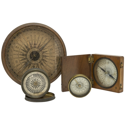 1460 - A WOODEN CASED POCKET COMPASS, a small brass cased compass, another smaller with a transit lock and ... 