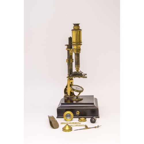 1463 - AN 18TH CENTURY CUFF TYPE MICROSCOPE POSSIBLY BY GEORGE STERROP the miscroscope on a shaped mahognay... 