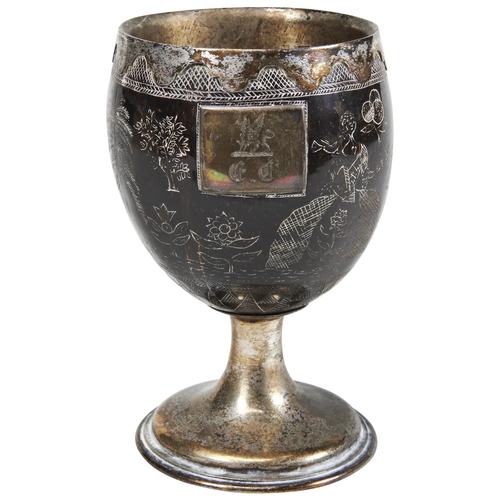 1782 - AN 18TH CENTURY SCRAFFITO DECORATED COCONUT MOUNTED AS A CHALICE WITH A WHITE METAL RIM,AND INTERIOR... 