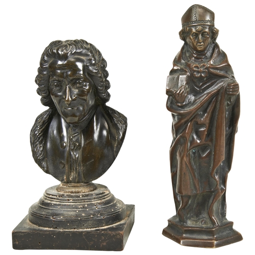 1791 - A 19TH CENTURY BRONZE BUST OF VOLTAIRE ON A WOODEN SOCLE BASE and a bronze figure of a bishop holdin... 