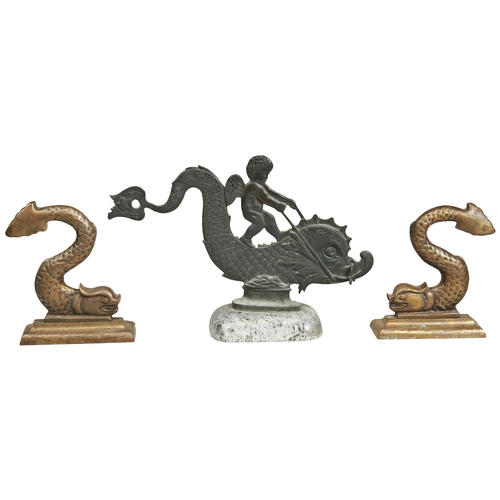 1821 - A COPPER ALLOY DOOR STOP in the Form of a Cherub riding a stylised dolphin in flat profile mounted o... 