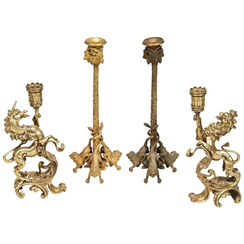 1973 - A PAIR OF GOOD COPPER ALLOY HERALDIC CANDLESTICKS in the form of a lion and unicorn and a pair of br... 