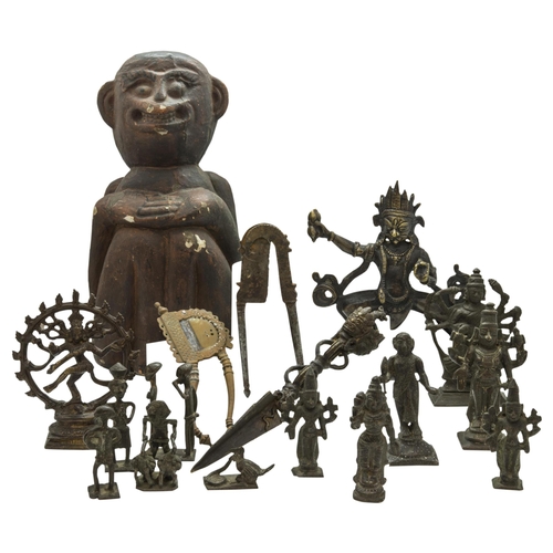 2234 - AN INDIAN CARVED WOODEN MONKEY, assorted bronze votive figures of various deities, Ashanti bronze go... 