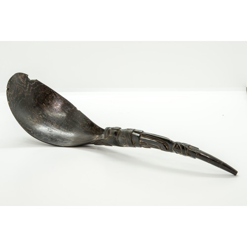 1341 - A 19TH CENTURY HAIDA OR INUIT MOUNTAIN GOAT HORN SPOON, the handle riveted to the bowl and Carved wi... 