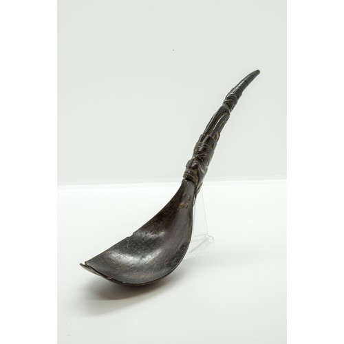 1341 - A 19TH CENTURY HAIDA OR INUIT MOUNTAIN GOAT HORN SPOON, the handle riveted to the bowl and Carved wi... 