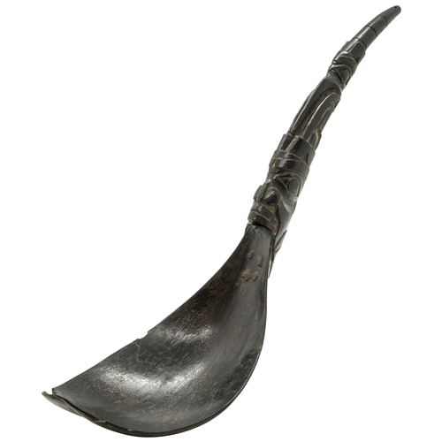 1341 - A 19TH CENTURY HAIDA OR INUIT MOUNTAIN GOAT HORN SPOON, the handle riveted to the bowl and Carved wi... 