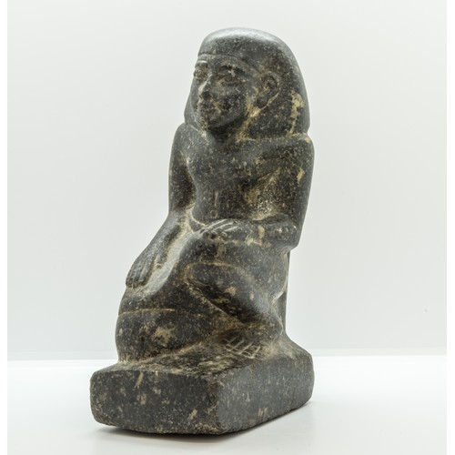 1299 - AN EGYPTIAN GRANITE FIGURE OF A KNEELING MAN, after the antique.25 cms high