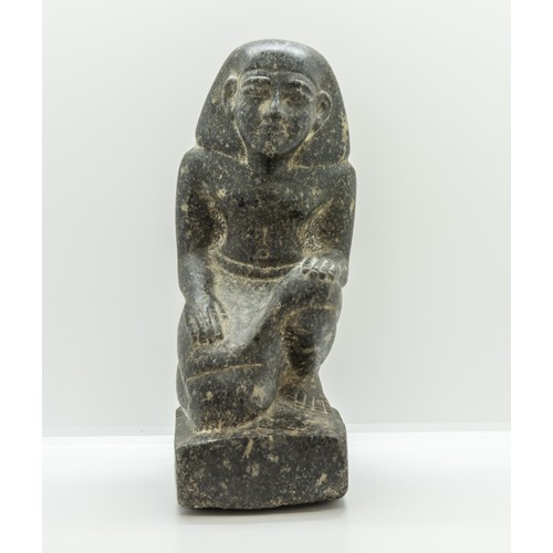 1299 - AN EGYPTIAN GRANITE FIGURE OF A KNEELING MAN, after the antique.25 cms high