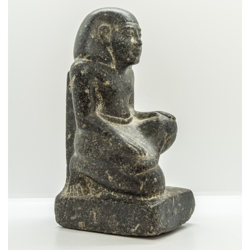 1299 - AN EGYPTIAN GRANITE FIGURE OF A KNEELING MAN, after the antique.25 cms high