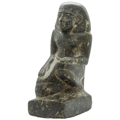 1299 - AN EGYPTIAN GRANITE FIGURE OF A KNEELING MAN, after the antique.25 cms high