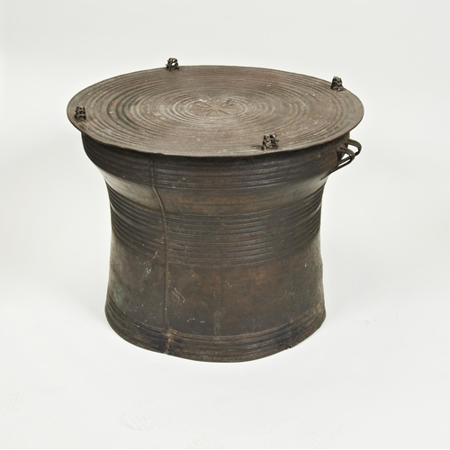 2237 - A SOUTH EAST ASIAN BRONZE RAIN DRUM CAST with concentric designs and stylised frogs with side handle... 