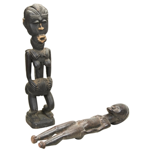 1351 - A WEST AFRICAN CARVED WOODEN FEMALE FERTILLITY FIGURE and another female figure. 56cms max.