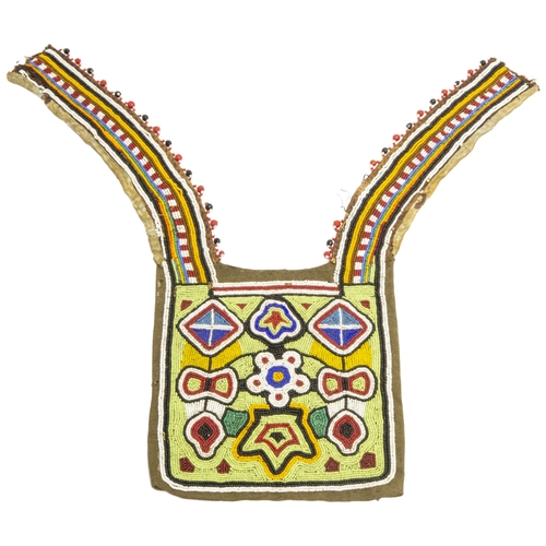 1356 - A NATIVE AMERICAN BEADWORK CLOTHING(?) Panel the ornately decorated square with two curved narrow pa... 