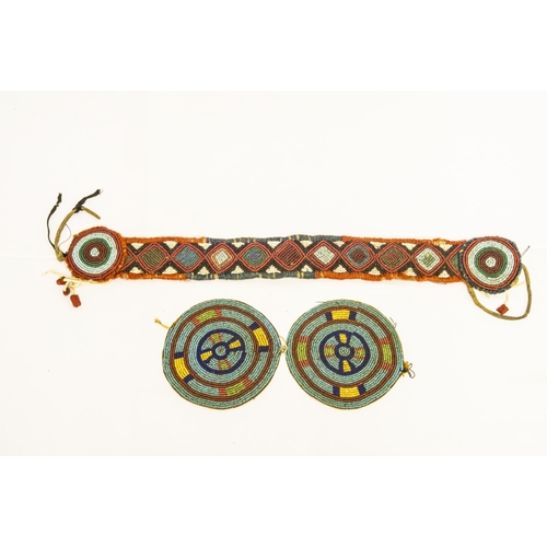 1357 - A NATIVE AMERICAN BEADED WAND, with four beaded strands tipped with strands of human hair, two beade... 