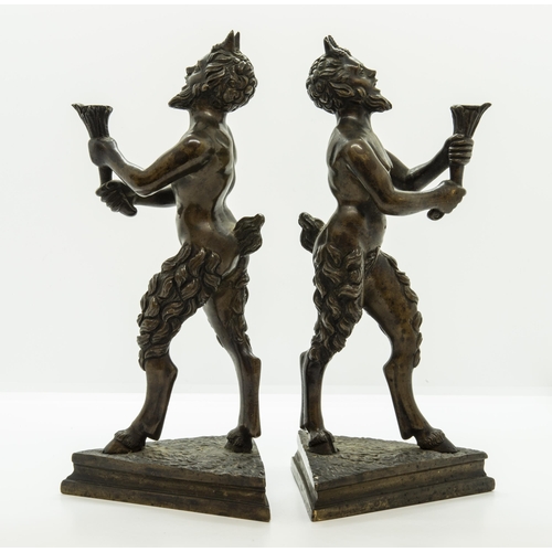 1830 - A PAIR OF BRONZE SATYR CANDLESTICKS IN THE MANNER OF SEVERO CALZETTA DA RAVENNA, Standing upon trian... 