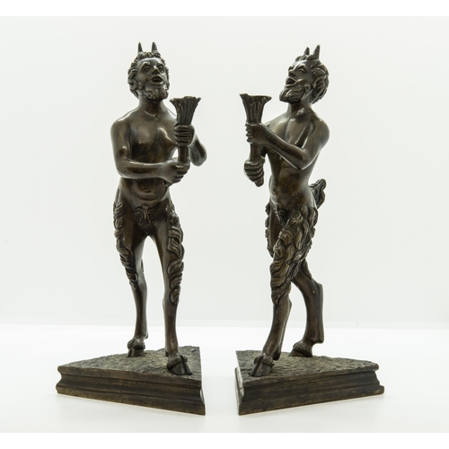 1830 - A PAIR OF BRONZE SATYR CANDLESTICKS IN THE MANNER OF SEVERO CALZETTA DA RAVENNA, Standing upon trian... 