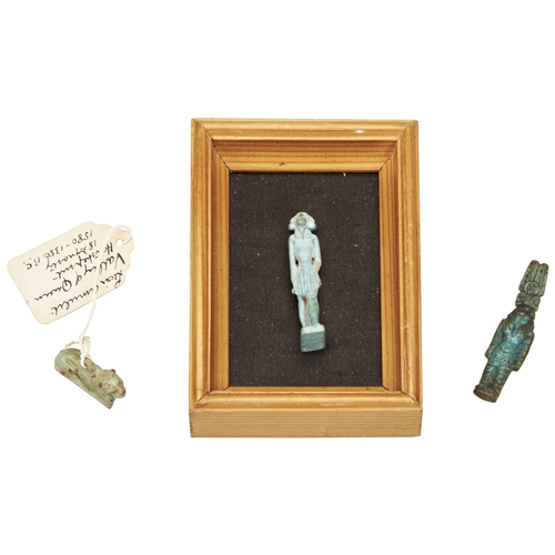 1310 - A FAIENCE AMULET OF KHNUM STANDING, And a faience amulet of a lion both with old labels, one the lio... 