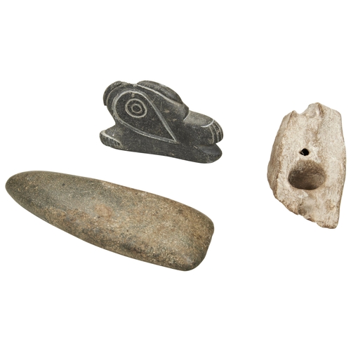 1314 - A NEOLITHIC POLISHED STONE AXE HEAD. A 'worked' stone with a hole and a flat stone carving of a styl... 