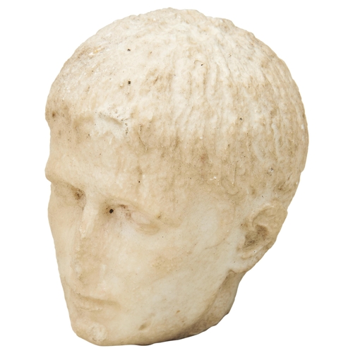 1318 - A SMALL ROMAN STYLE MARBLE HEAD OF A MALE. Possibly The Young Augustus Caesar, degraded and with a b... 