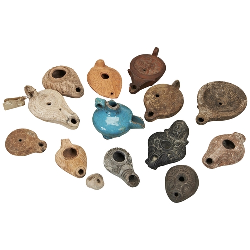 1323 - A ROMAN POTTERY OIL LAMP CIRCA 2nd CENTURY. and various other oil lamps, mostly ancient but with som... 