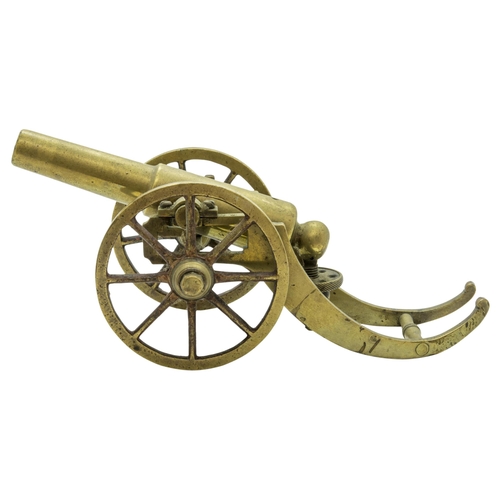 708 - A MODEL OF A VICTORIAN BATTERY GUN the cast barrel upon a rolling carriage mounted on a platform bas... 