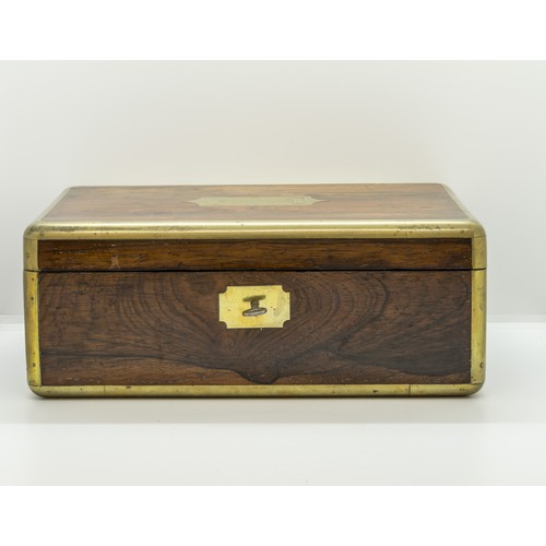 710 - A GOOD CAMPAIGN ROSEWOOD TOILET BOX the lid inscribed Lt. Colonel Knolly, 3rd Guards, the fitted int... 