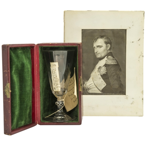 NAPOLEON; A CHAMPAGNE GLASS PURPORTEDLY BELONGING TO NAPOLEON and bearing an old handwritten label ‘13. Champagne Glass of Napoleon I. certified by the Rev. Robert Hall Of Bristol’ also with a tie-on tag ‘Napoleon’s Wine Glass belonging to Miss Abbot, Sweet Oaks Dulverton’, contained in a custom made morocco case with velvet lining with paper label to the base and a Stevenograph of Napoleon. 14.7 cms
