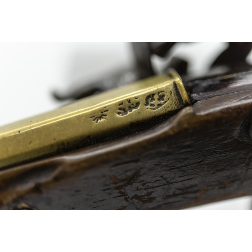 767 - T. HENSHAW, A FLINTLOCK PISTOL with brass barrel, the lock marked T. Henshaw, the stock of plain for... 