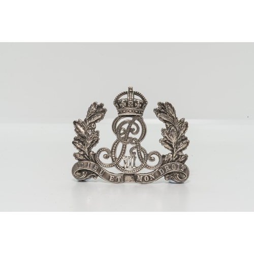 768 - A VICTORIAN OR'S MILITIA ARTILLERY HELMET PLATE, a Victorian ‘silver’ helmet plate and t... 