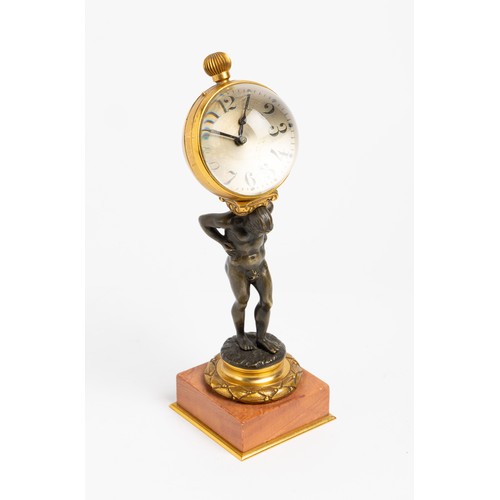 128 - A NOVELTY TIMEPIECE keyless lever ball watch mounted on the back of a bronze Atlas on pink marble an... 