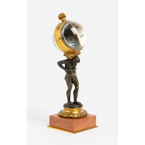 128 - A NOVELTY TIMEPIECE keyless lever ball watch mounted on the back of a bronze Atlas on pink marble an... 