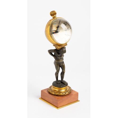 128 - A NOVELTY TIMEPIECE keyless lever ball watch mounted on the back of a bronze Atlas on pink marble an... 