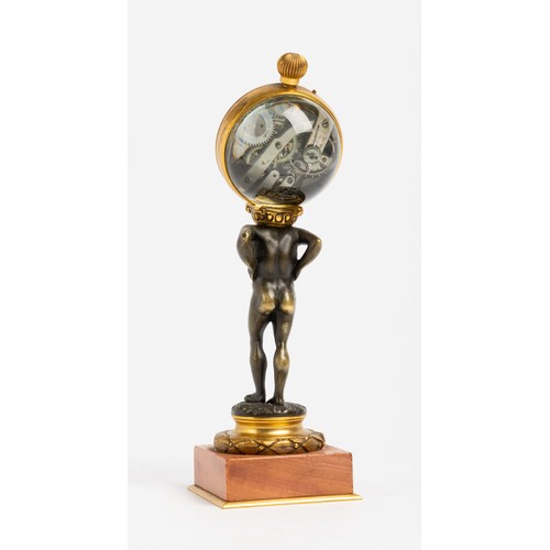 128 - A NOVELTY TIMEPIECE keyless lever ball watch mounted on the back of a bronze Atlas on pink marble an... 